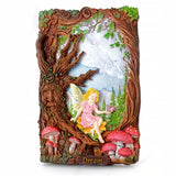 Decorative wall art with fairy, mushrooms, and tree design on a white background