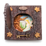 Decorative box with fairy and tree spirit design, featuring a key and 'BELIEVE' inscription.