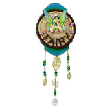 Decorative wall hanging with fairy design and rattan basket on a white background