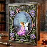 Decorative book titled 'Fairy Tales' with a fairy illustration on a wooden surface.