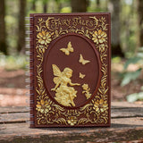 Notebook with fairy design on a wooden surface with a forest background