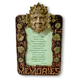 Decorative plaque with a leafy face design and 'Memories' text on a white background