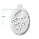 An oval white 3D X-3D silicone mold featuring an embossed bird perched on a branch with leaves and berries, shown with green dimension lines indicating a height of 52mm.
