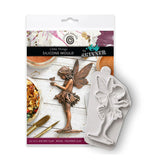 Silicone mould of a fairy with packaging featuring an image of the mould in use.