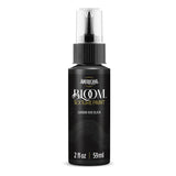 A bottle of Americana BLOOM Texture Paint in the color Carbon Void Black, featuring a black body, clear spray cap, and gold and white lettering on a white background.