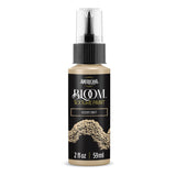 A bottle of Americana BLOOM Textured Paint in the 'Desert Drift' color, featuring a black label with gold and white lettering and a textured paint sample graphic, on a clean white background.