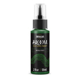 A bottle of Americana BLOOM Textured Paint in Emerald Forest, featuring a dark green body, black cap, and a black label with white and gold text.