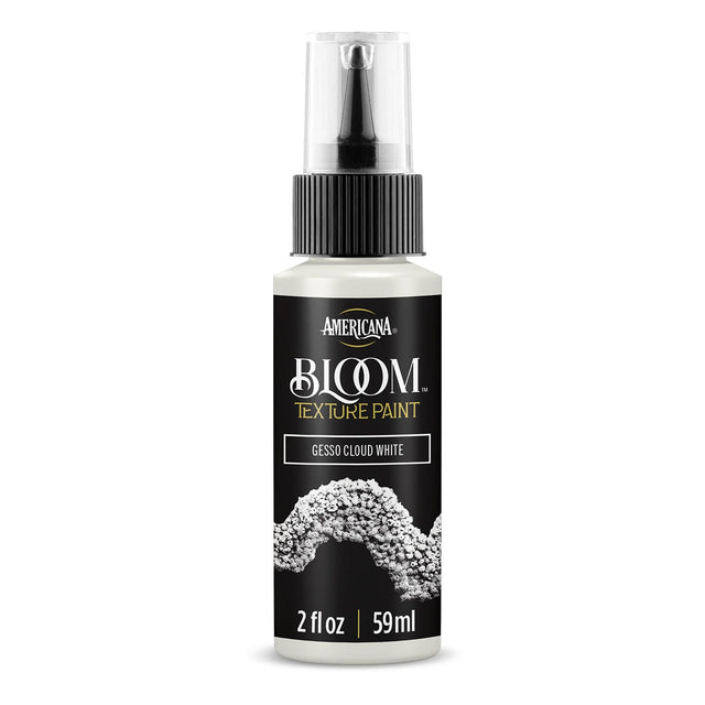 A bottle of Americana BLOOM Textured Paint in the color 'Gesso Cloud White', featuring a black label with gold and white lettering and a textured white paint splash graphic, on a clean white background.