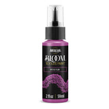 A bottle of Americana BLOOM Textured Paint in the shade Mystic Plum, featuring a black label with purple text and a purple paint texture graphic, on a white background.