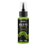 A bottle of Americana BLOOM Textured Paint in the shade Verdant Pulse Green, featuring a black label with gold lettering and a textured paint sample graphic, on a white background.