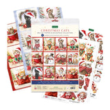 Christmas Cats die-cut feline scenes collection by Canva, featuring a central package surrounded by scattered individual cut-out scenes and stickers on a white background.
