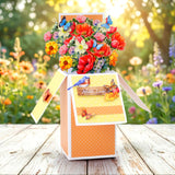Colorful bouquet in a box with butterflies against a garden background