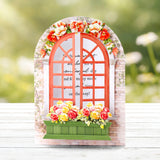 Decorative window frame with flowers on a blurred natural background
