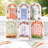 Set of decorative garden doors with floral decorations and text on a wooden surface.