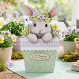 Decorative bunny in a pot with flowers and a 'You're Some Bunny Special' tag, surrounded by plants.