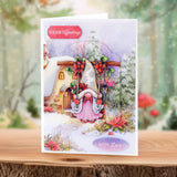 Christmas card with a fairy in front of a snowy house, featuring 'Season's Greetings' and 'With Love' text.