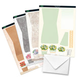 Set of paper crafting sheets with floral designs and an envelope on a white background