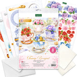 Card making kit with floral designs and cardstock sheets on a white background