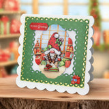 Christmas-themed greeting card with Santa Claus and gift boxes on a decorative background.