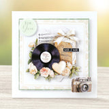 Decorative card with vinyl record, flowers, and vintage camera on a gradient background
