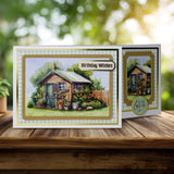 Greeting card with a garden shed illustration and 'Birthday Wishes' text on a wooden surface.