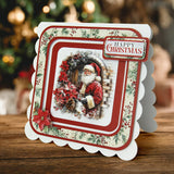 Christmas card with Santa Claus and decorative elements on a wooden surface.
