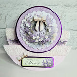 Decorative card with floral design and 'thinking of you Always' message on a textured surface.