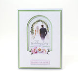 Wedding card with a couple under a floral arch and decorative text on a white background