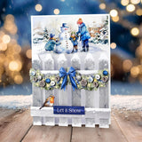 Winter scene with children building a snowman, decorated card with 'Let it Snow' text, and festive lights in the background.