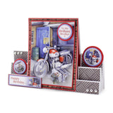 A 3D pop-up birthday card set featuring a central motorcycle-themed card with a red border, a small 'Happy Birthday' card, and two circular stickers, all displayed on a clean white background.