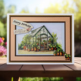 Greeting card with a greenhouse illustration and 'Happy Birthday' message on a wooden surface.