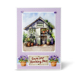Greeting card with a garden shed and potted plants on a purple polka dot background.