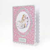 Decorative card with floral pattern and cake illustration on a white background