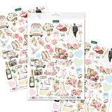 Sheet of wedding-themed die-cut embellishments with flowers, cars, and other decorative elements.