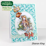 Mermaid card with seashells and fish on a polka dot background, featuring Katy Sue Designs branding.