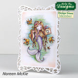 Card with a mermaid design featuring fish and a decorative frame, branded with Katy Sue Designs.