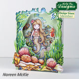 Colorful mermaid illustration with sea-themed elements on a white background, featuring 'Kathy Ice Designs' branding.