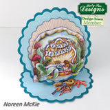 Decorative card with mermaid design inside a shell, featuring 'Kathy Sue Designs' on a white background.
