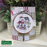 Christmas card with two snowmen and gift boxes, surrounded by decorative plants.