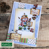 Christmas card with a snowman design on a wooden surface