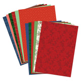Stack of red and green patterned paper sheets on a white background