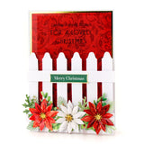 Christmas card with red and white flowers and decorative text on a white background