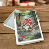 Greeting card with a gnome illustration on a wooden surface
