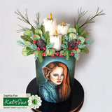 Decorative candle with floral arrangement and portrait on a white background