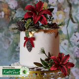 Decorative cake with red flowers, pinecones, and greenery against a floral background