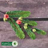 Decorative green leaf and berry embellishment on a wooden surface with Katy Sue Flower Pro branding.