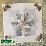 Decorative card with floral design and pinecones on a textured surface