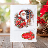 Christmas card with Santa Claus and poinsettias on a wooden surface with festive decorations.