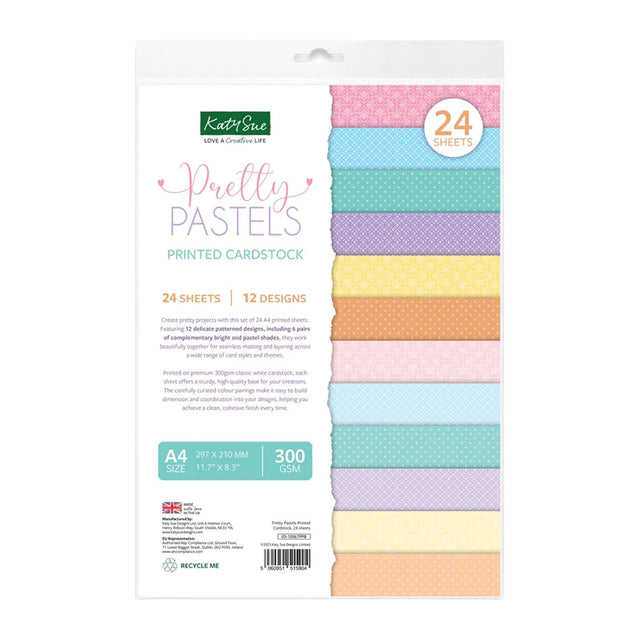 Kitty Sue Pretty Pastels Printed Cardstock pack containing 24 sheets of 12 different pastel patterned cardstock designs, shown in its retail packaging with a clear window displaying the colorful sheets.