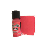 Bottle of distress paint with a red swatch on a white background
